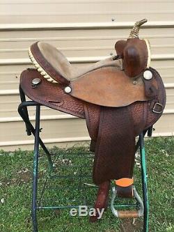Used US made15 Western barrel saddle withbasket stamped leather good condition