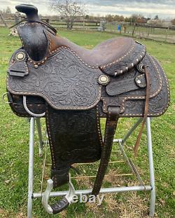 Used/Vintage 15 RYON buckstitched Western saddle withtooled cutting horses