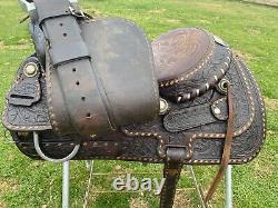 Used/Vintage 15 RYON buckstitched Western saddle withtooled cutting horses