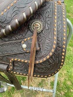 Used/Vintage 15 RYON buckstitched Western saddle withtooled cutting horses