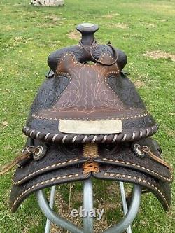 Used/Vintage 15 RYON buckstitched Western saddle withtooled cutting horses