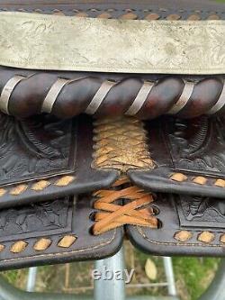 Used/Vintage 15 RYON buckstitched Western saddle withtooled cutting horses