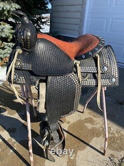 Used/vintage 15.5 black leather Western parade saddle withtapaderos, silver