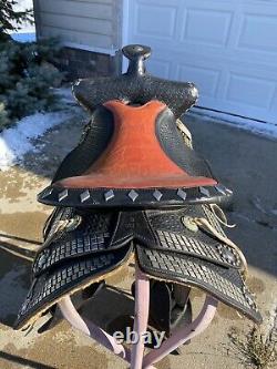 Used/vintage 15.5 black leather Western parade saddle withtapaderos, silver