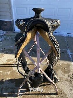 Used/vintage 15.5 black leather Western parade saddle withtapaderos, silver