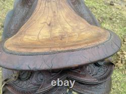Used /vintage 15 tooled round skirt Western saddle for round withers US made
