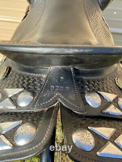 Used/vintage 15black basket stamped leather Western parade saddle withtapaderos