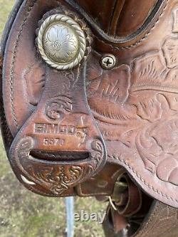 Used/vintage Simco 15 tooled Western saddle withsilver conchos