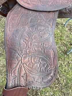 Used/vintage Simco 15 tooled Western saddle withsilver conchos