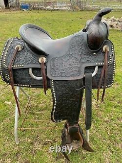 Used/vintage THE Saddlery floral tooled spotted black Western saddle withtapaderos