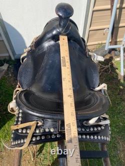 Used/vintage/antique 12 studded leather western pony saddle withwhite strings