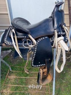 Used/vintage/antique 12 studded leather western pony saddle withwhite strings