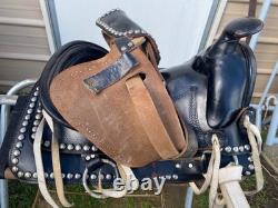 Used/vintage/antique 12 studded leather western pony saddle withwhite strings