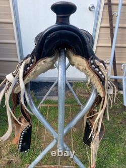 Used/vintage/antique 12 studded leather western pony saddle withwhite strings