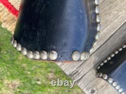 Used/vintage/antique 12 studded leather western pony saddle withwhite strings