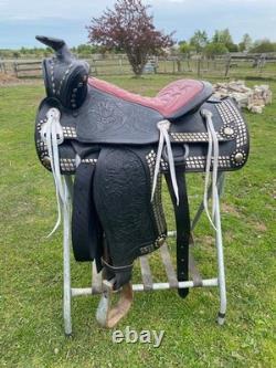 Vintage/used 15.5 Western parade saddle withsilver diamonds, red seat
