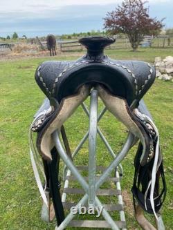 Vintage/used 15.5 Western parade saddle withsilver diamonds, red seat