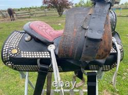 Vintage/used 15.5 Western parade saddle withsilver diamonds, red seat