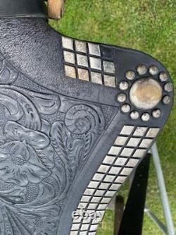 Vintage/used 15.5 Western parade saddle withsilver diamonds, red seat