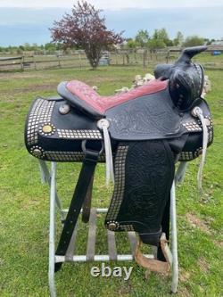 Vintage/used 15.5 Western parade saddle withsilver diamonds, red seat