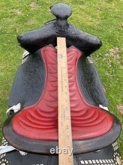 Vintage/used 15.5 Western parade saddle withsilver diamonds, red seat
