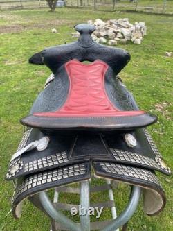 Vintage/used 15.5 Western parade saddle withsilver diamonds, red seat