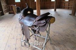 Vinton Western Cutter Saddle with rough out seat and fender. Basketweave design