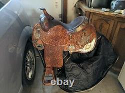 Western show saddle- beautifully tooled and in good shape